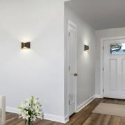 Helestra LED-vegglampe VID, svart/gull, opp/ned, IP65