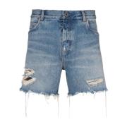 Blå denimshorts med ripped-effekt